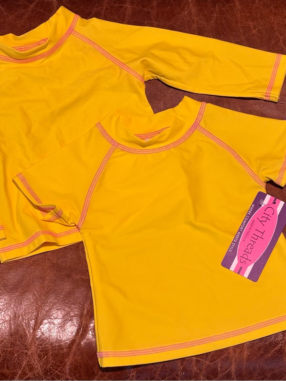 Two Bright Yellow Kids Rash Guard with Pink Stitching UPF 50+
